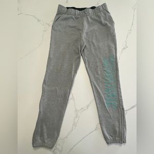 NIKE grey joggers with pockets and ankle zippers size small